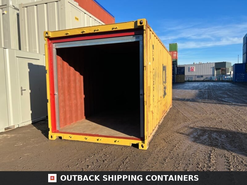 20ft used shipping container in yellow with an open roller shutter door on the short end in a container yard