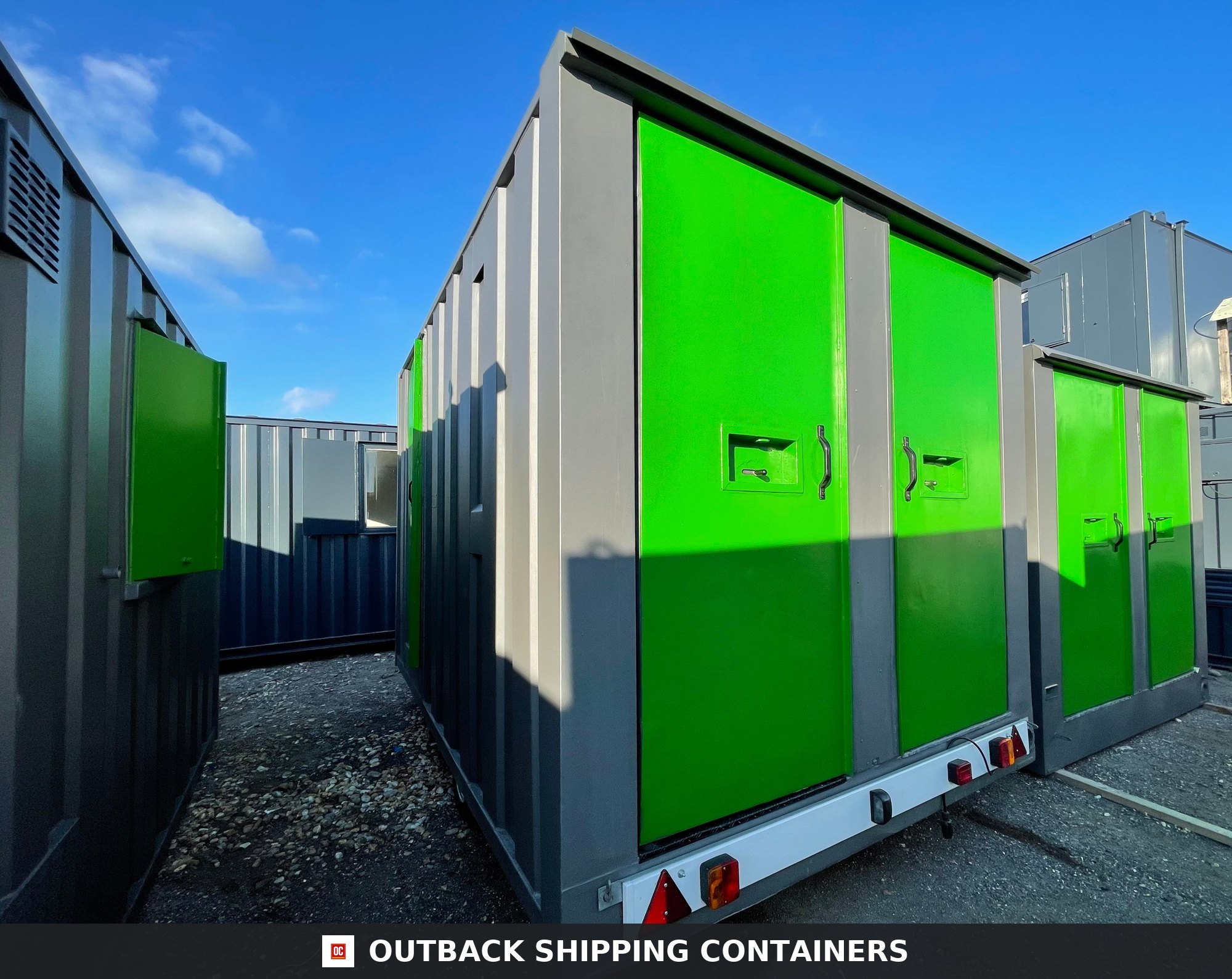 Towable Groundhog Mobile Welfare |Towable Canteen, Office, WC — Roof and Structural Detail Rear view of a grey towable Groundhog mobile welfare unit with vibrant green doors and integrated safety lighting