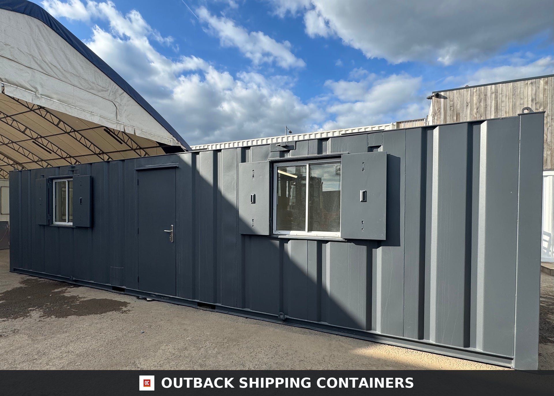 32ft Cabin for Sale — Interior Detail | Outback Shipping Containers 2 3 Refurbished 32ft anti-vandal portable cabin in dark grey with steel shutters and single personnel door