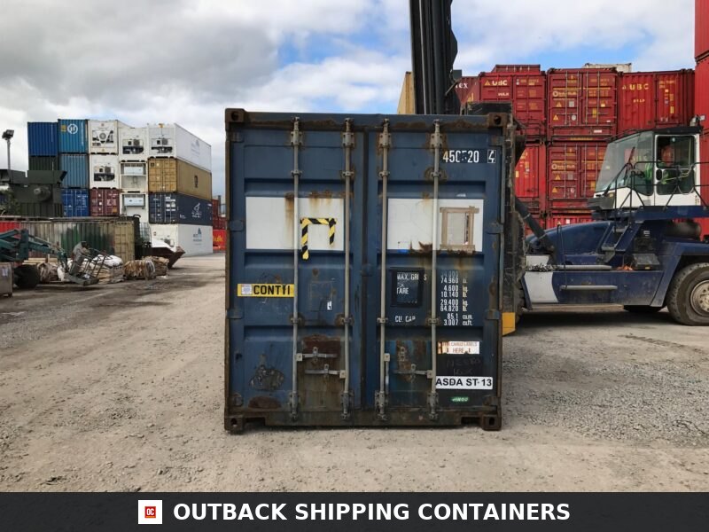 45ft Used Shipping Containers for Sale — Interior View | Outback Shipping Containers Rear view of used 45ft shipping container showing locked cargo doors and heavy surface wear in a storage yard