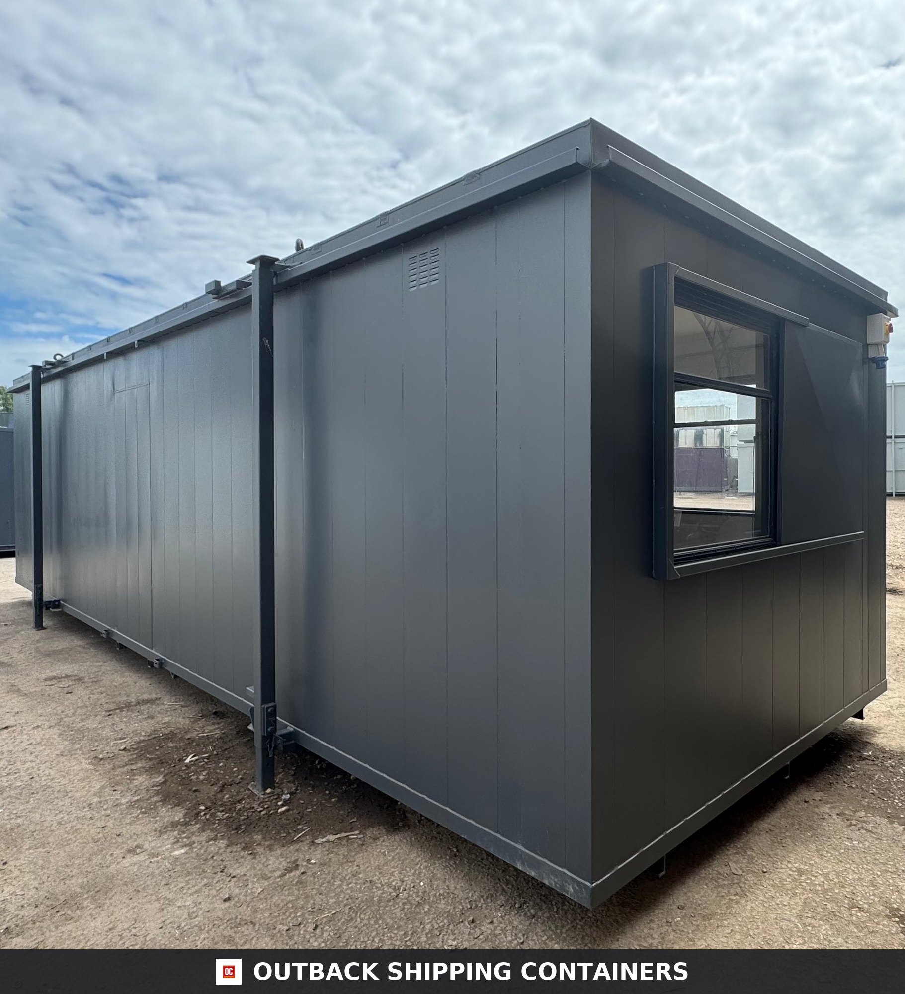 32x10 ft 32x10FT for Sale — Door and Entry Detail | Outback Shipping Containers Refurbished 32x10 portable building in charcoal grey showing long side panel and end window with security shutter