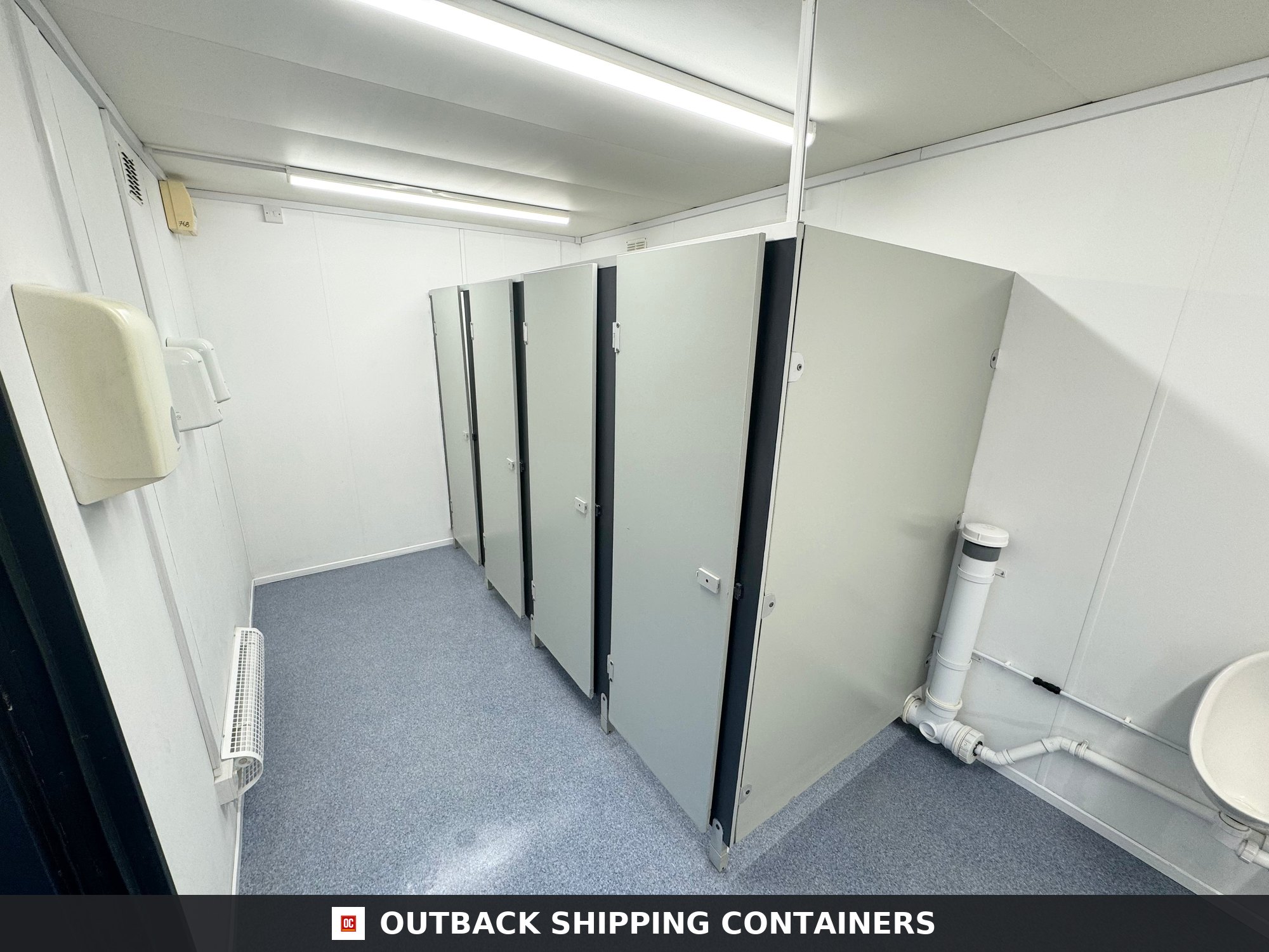 24 x 9 ft for Sale — Three-Quarter Angle View | Outback Shipping Containers 24 x 9 ft — 4 + 1 Toilet Block — Anti-Vandal Portable Site Accommodation — No 768 — product gallery image 2 of 17