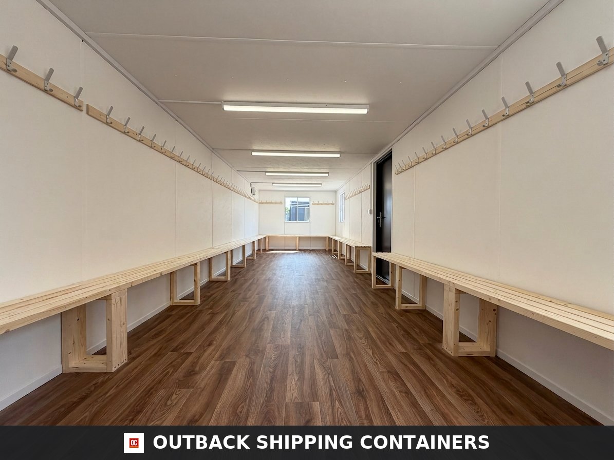 32x10ft Cabin for Sale — Side Profile View | Outback Shipping Containers 2 3 4 Interior view of a 32x10ft container drying room with wooden benches and coat hooks on white walls