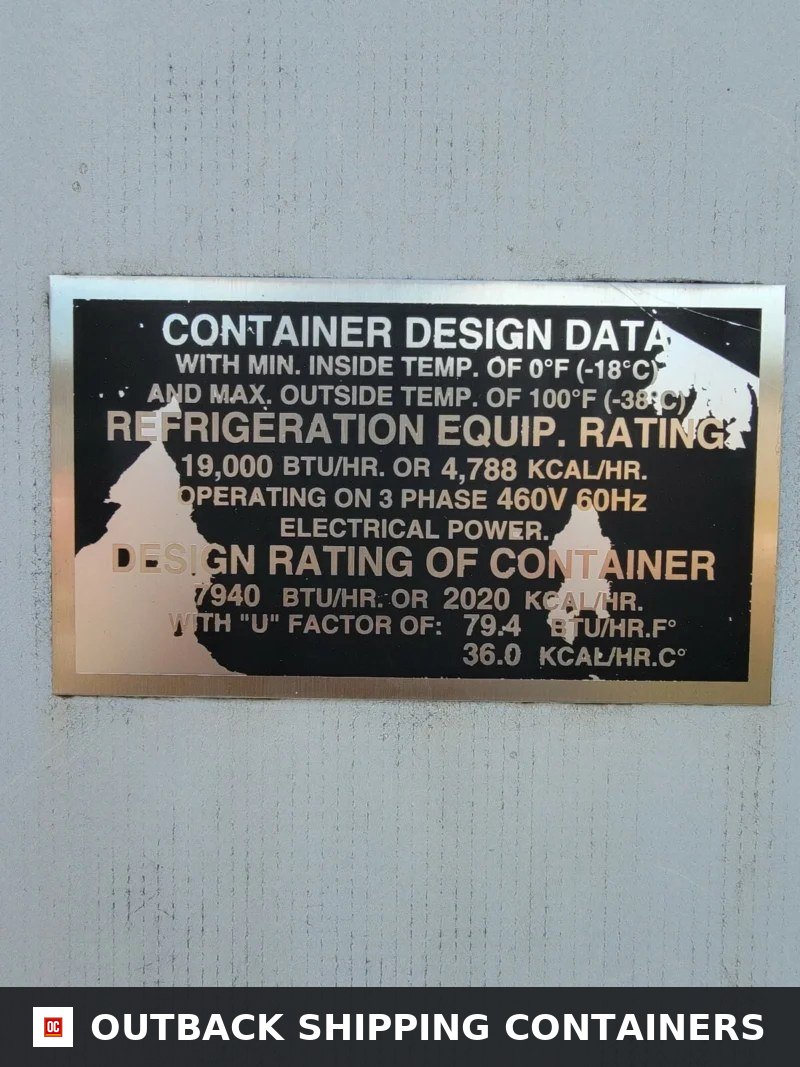 Close up view of the black and silver metal container design data plate on a refrigerated storage unit