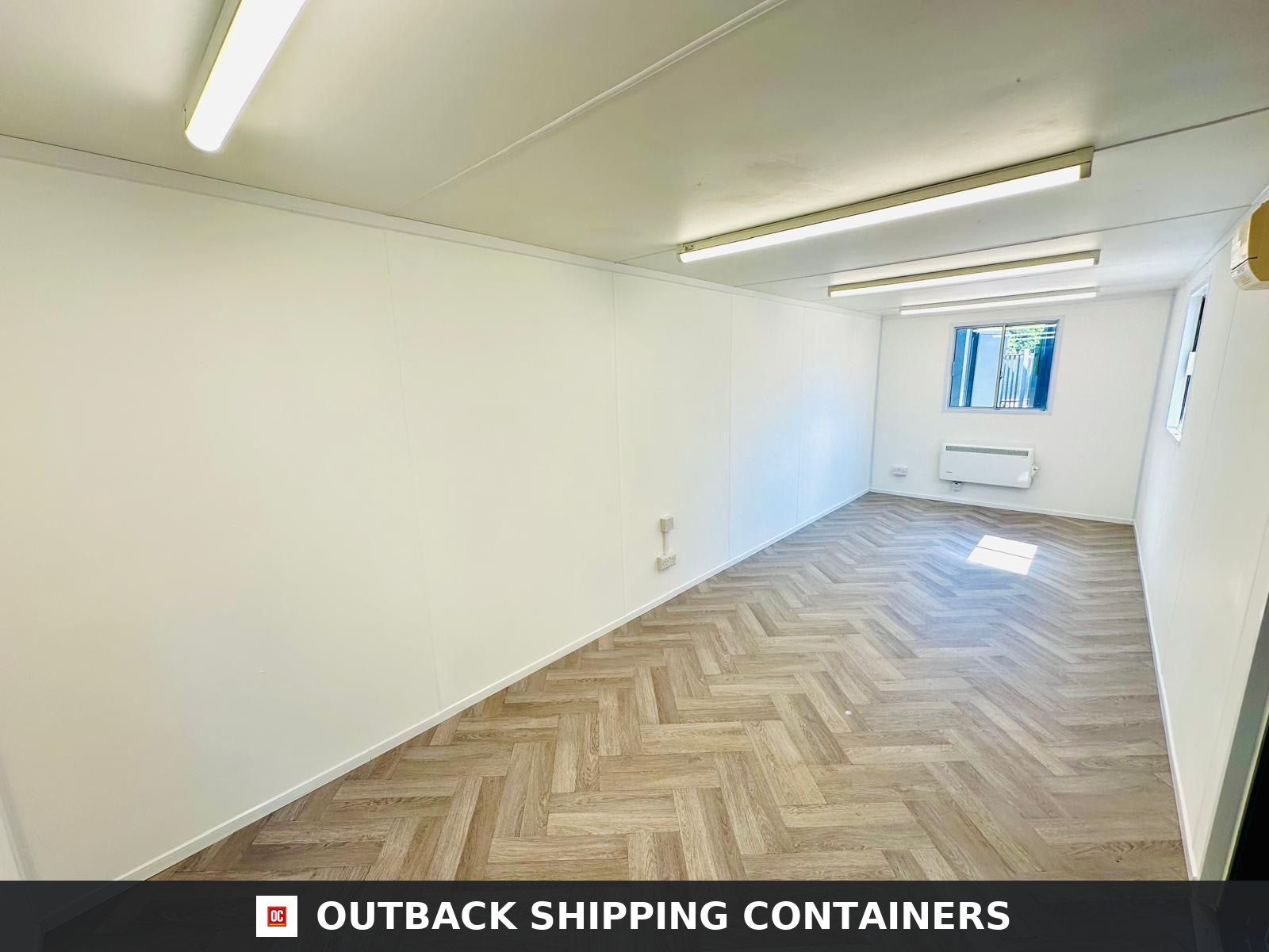 24x9 ft 24x9FT for Sale — Interior View | Outback Shipping Containers Dark grey 24x9 ft anti-vandal office cabin with corrugated steel walls and security window shutters