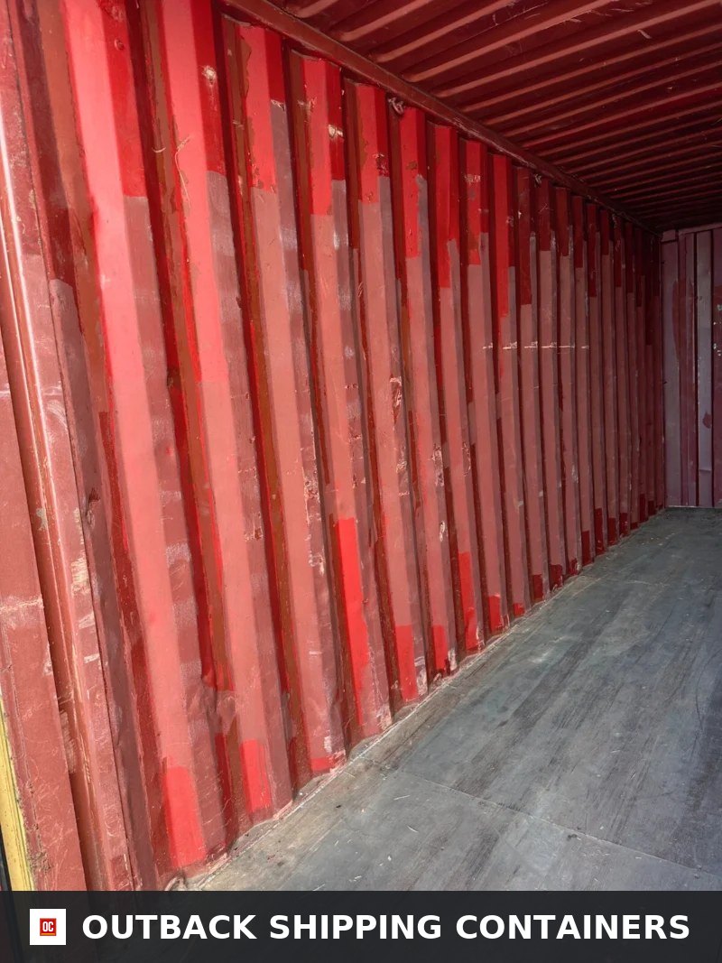 Used 20ft Conex Shipping / Storage Container — Rear Exterior View | Outback Shipping Containers Interior view of used 20ft conex container showing red corrugated steel walls and wood flooring