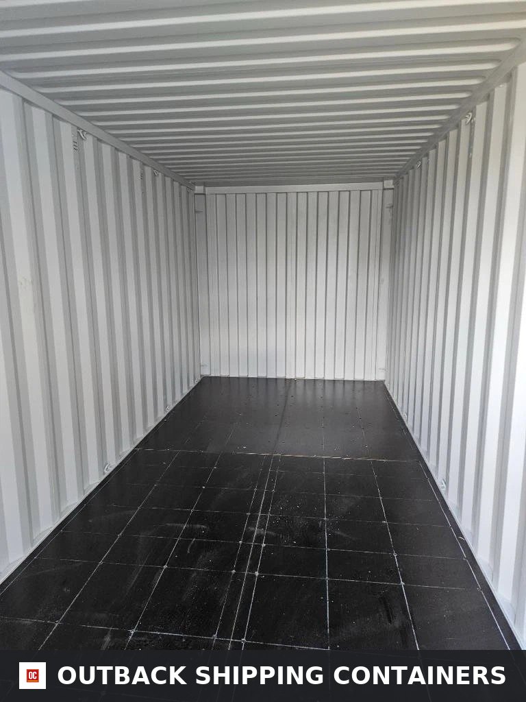 20ft Camouflage Storage Container for Sale — Rear Exterior View | Outback Shipping Containers Interior view of a 20ft storage container with white corrugated walls and dark tiled flooring