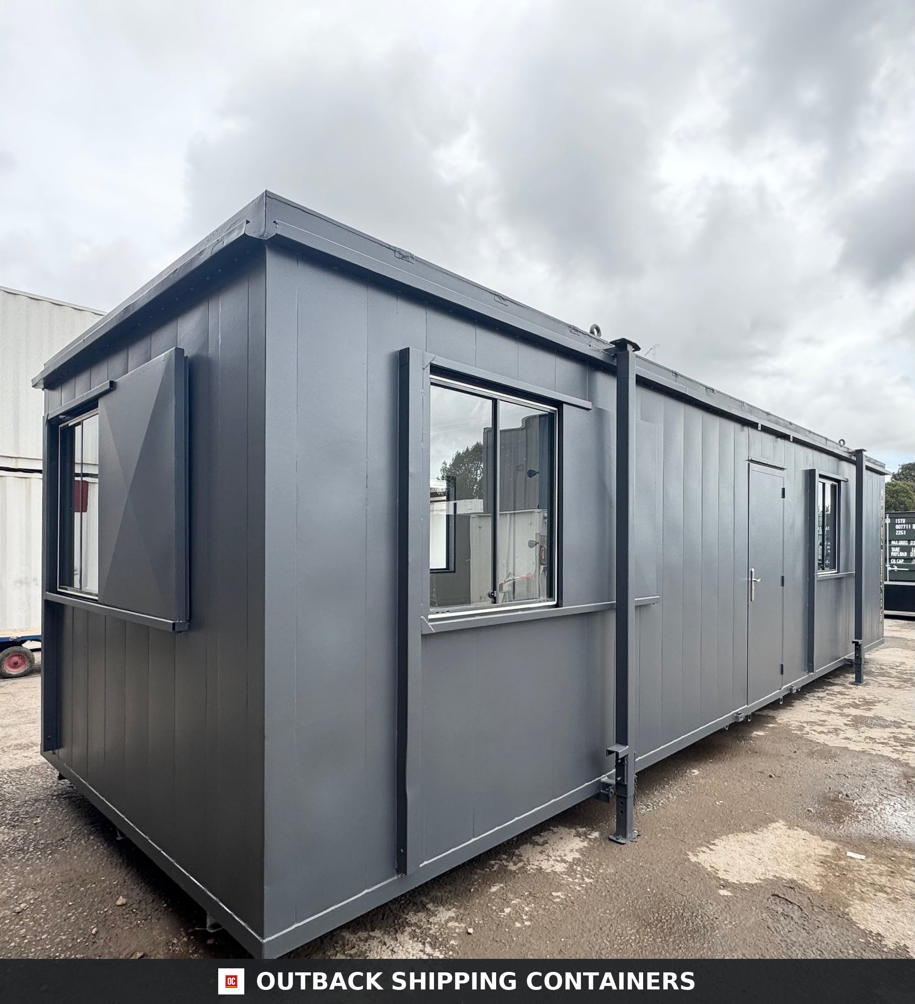 32x10Ft for Sale — Door and Entry Detail | Outback Shipping Containers Refurbished office cabin interior featuring herringbone flooring, sink unit, electric heater, and two windows