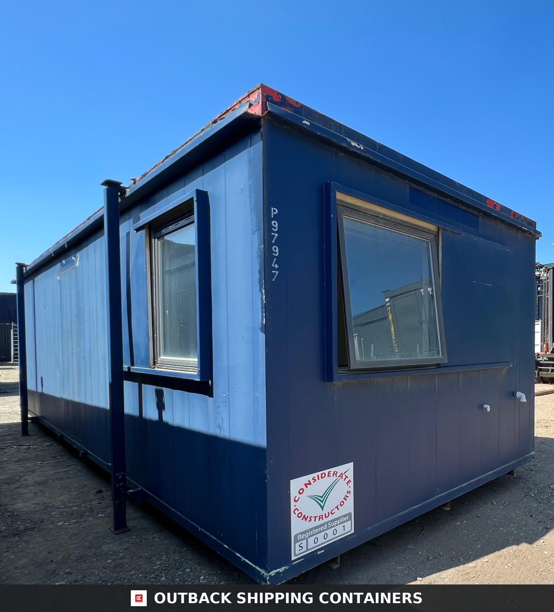 24x9 ft 24X9FT for Sale — Roof and Structural Detail | Outback Shipping Containers Exterior view of a blue 24x9ft refurbished anti-vandal office cabin with two large tilt windows