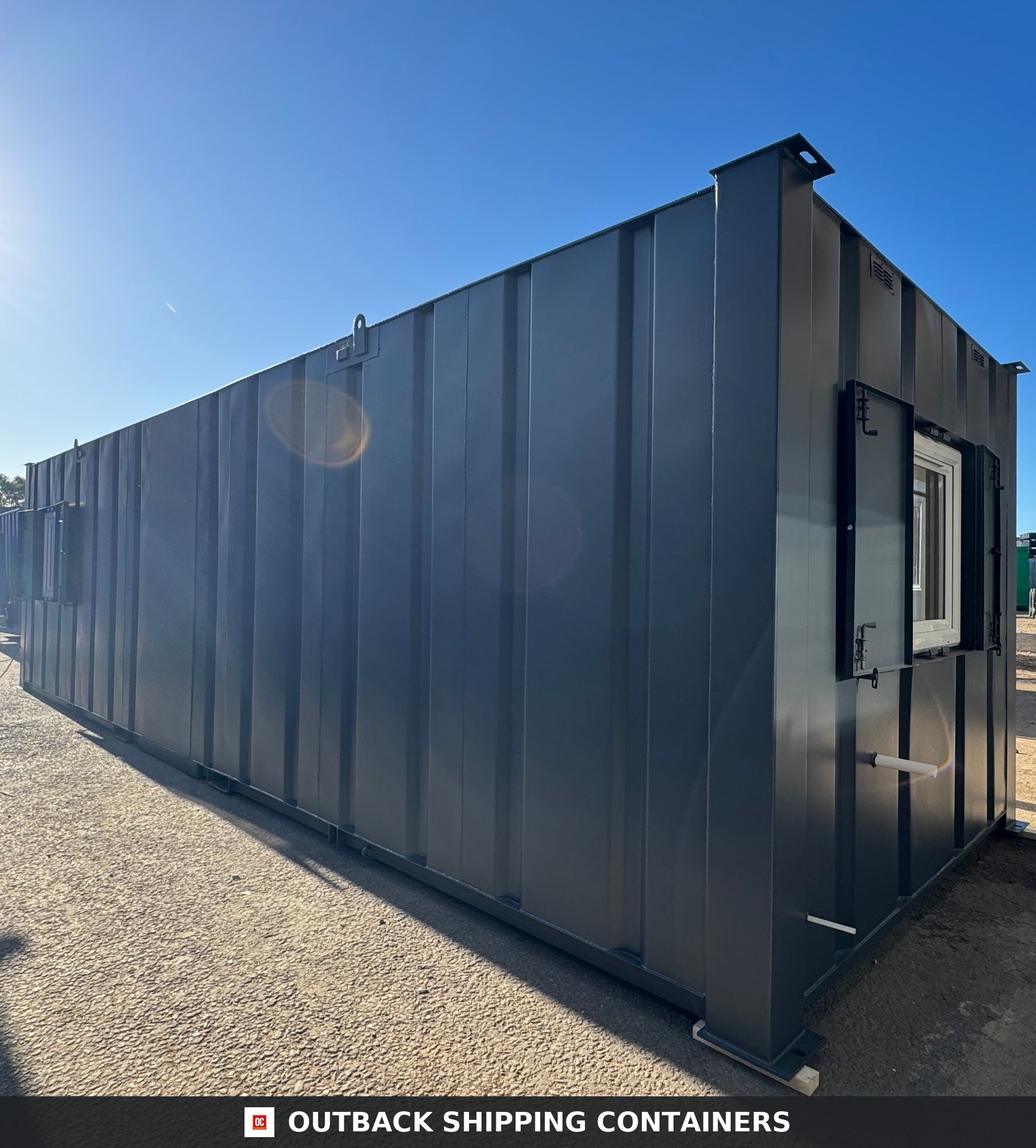 32x10ft Cabin for Sale — Roof and Structural Detail | Outback Shipping Containers Refurbished 32x10 cabin interior showing a long open plan room with white walls, wood floors, and ceiling lights