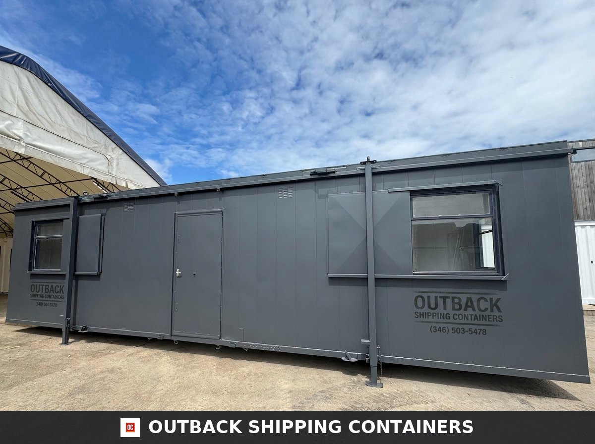32x10 ft 32x10FT for Sale — Side Profile View | Outback Shipping Containers Refurbished 32x10 ft dark grey anti-vandal portable cabin with steel shutters and central door under a bright sky