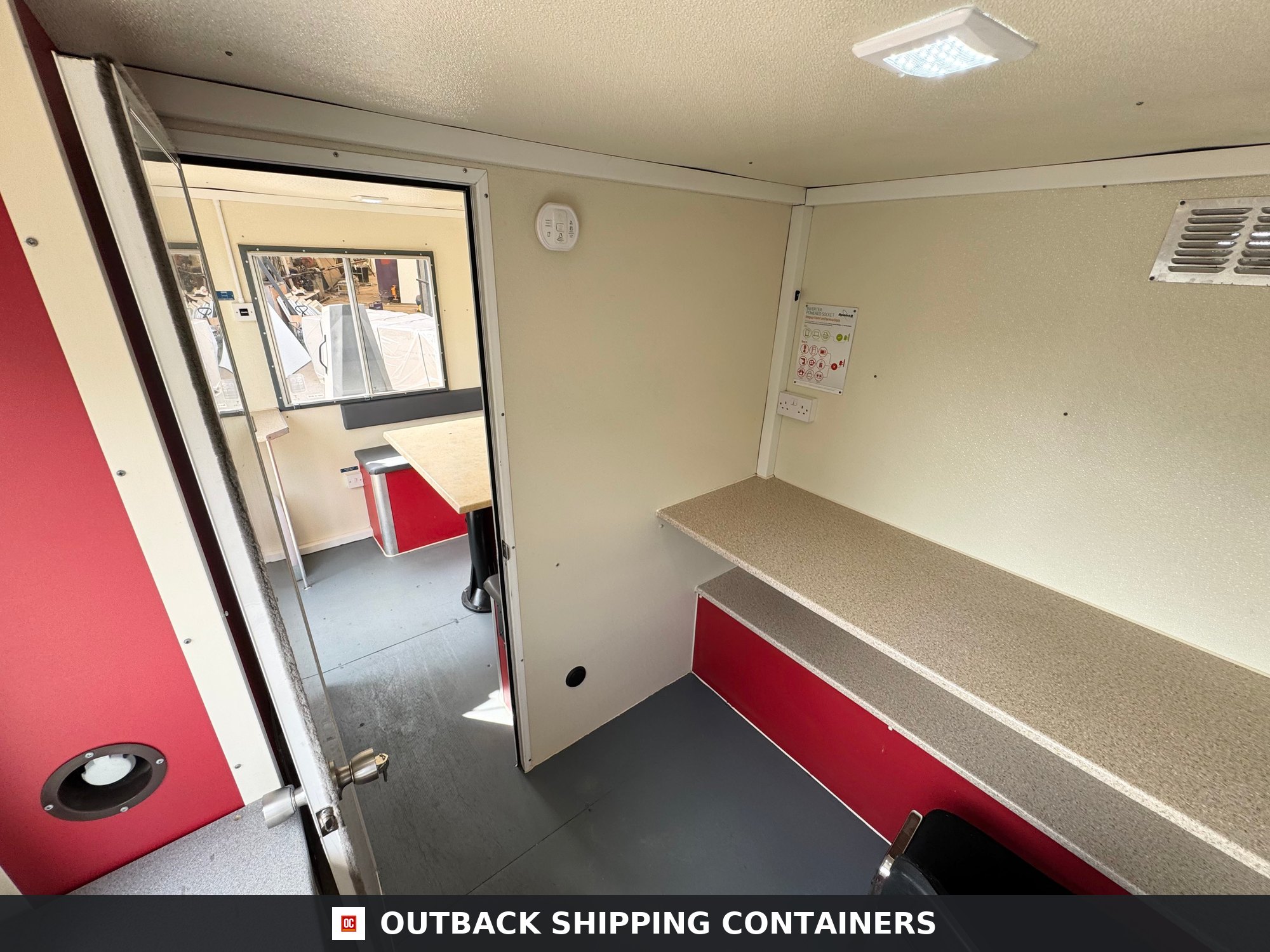 Groundhog Towable Mobile Welfare | 16 Ft | 2017 |Twin Axle | GPO500 — Door and Entry Detail Interior view of Groundhog GP500 mobile welfare unit showing two-tier work surfaces and red base cabinets