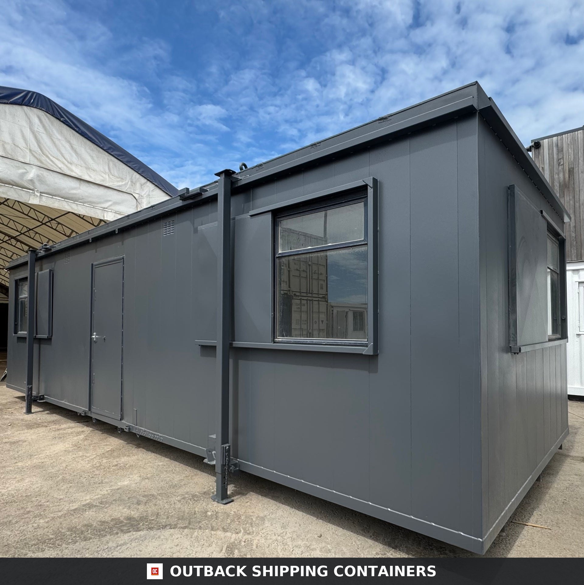 32x10 ft 32x10FT for Sale — Corner Casting and Frame Detail | Outback Shipping Containers Refurbished 32x10 anti-vandal portable building in dark gray steel with two rooms and secure window shutters