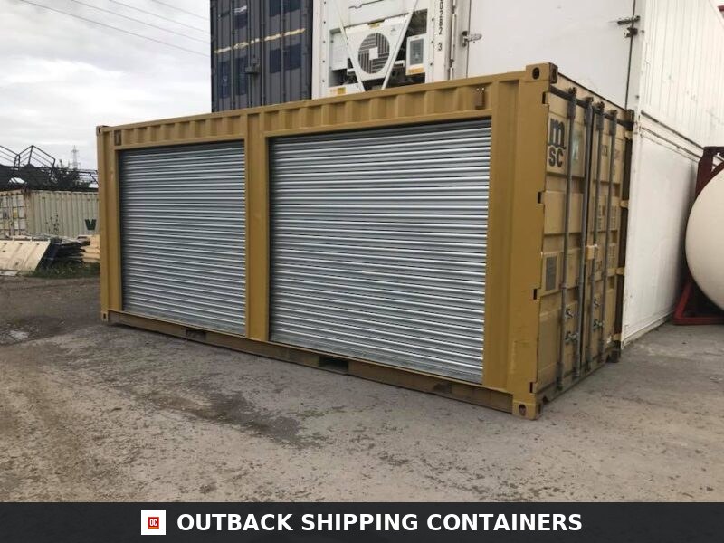 Yellow 20ft Used Container for Sale — Interior View | Outback Shipping Containers Yellow 20ft used shipping container with dual silver roll-up doors installed on the long side panel in a yard