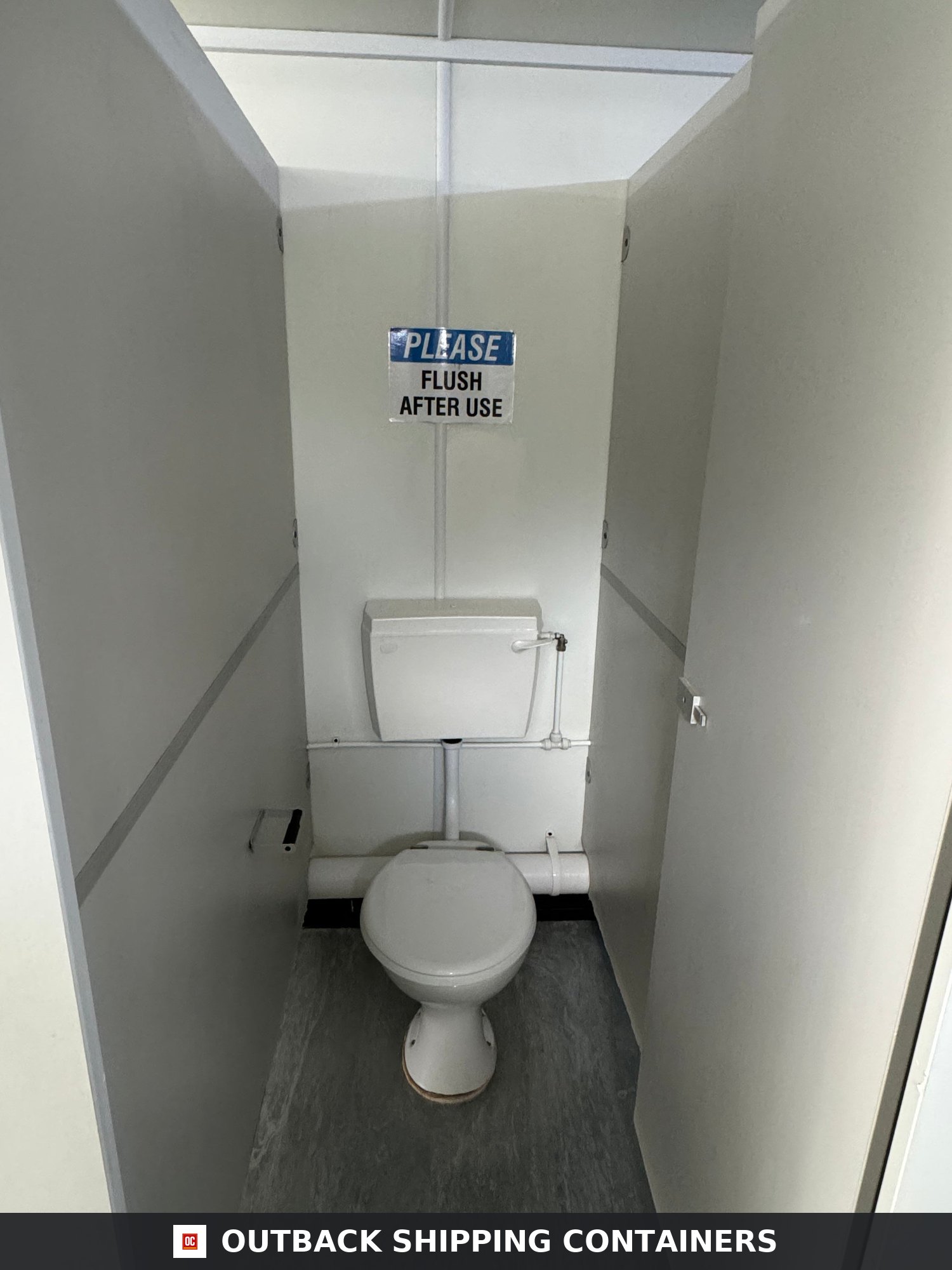 21x8ft for Sale — Three-Quarter Angle View | Outback Shipping Containers Interior view of a toilet stall inside a white 21ft portable canteen cabin featuring a ceramic toilet and signage