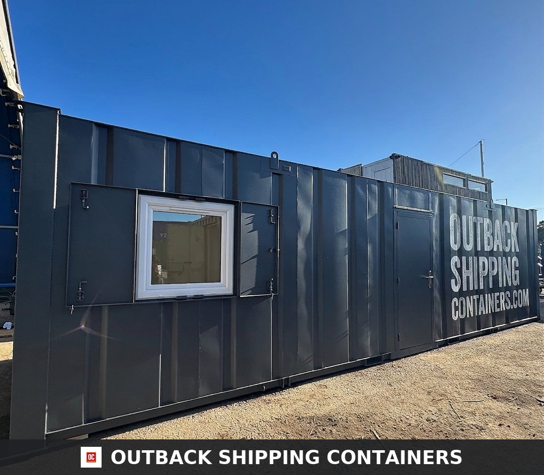 32x10ft Cabin for Sale — Interior View | Outback Shipping Containers Refurbished canteen interior of a portable building with wood-effect countertop, stainless steel sink, and white walls