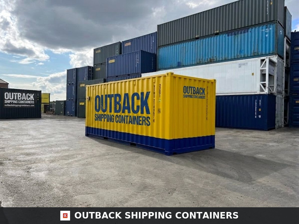 20ft yellow and blue custom modified one-trip container in a shipping terminal alongside stacked steel units