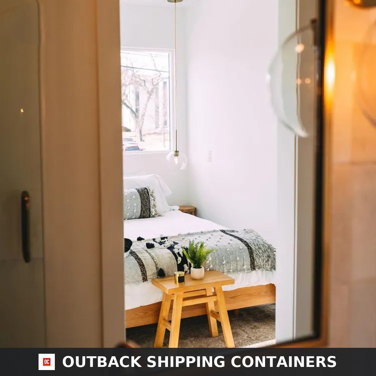 View through the upper level doorway into a bedroom of the Duplex 3BHK container home