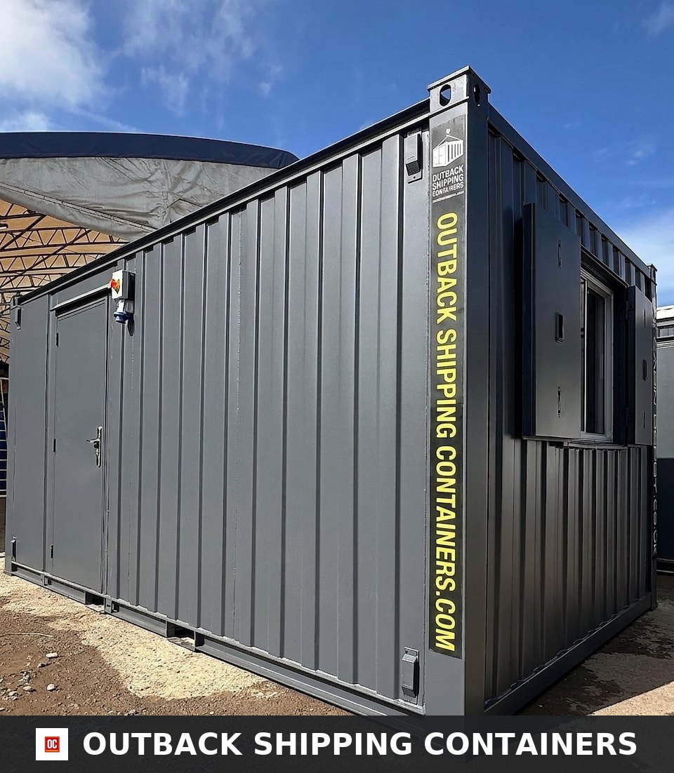 16x9 ft 16x9FT for Sale — Three-Quarter Angle View | Outback Shipping Containers 16x9 ft refurbished anti-vandal portable building in dark gray with a steel door and shuttered window