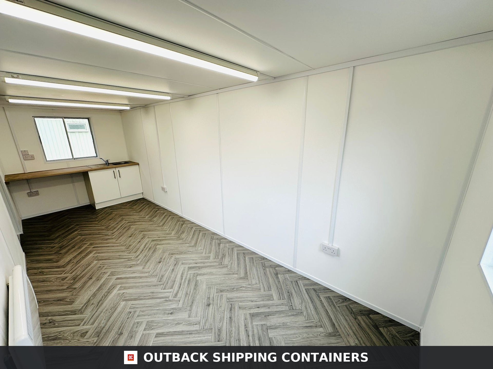 21x8ft for Sale — Window and Shutter Detail | Outback Shipping Containers Interior of a refurbished 21x8 anti-vandal office container with white walls and grey herringbone flooring