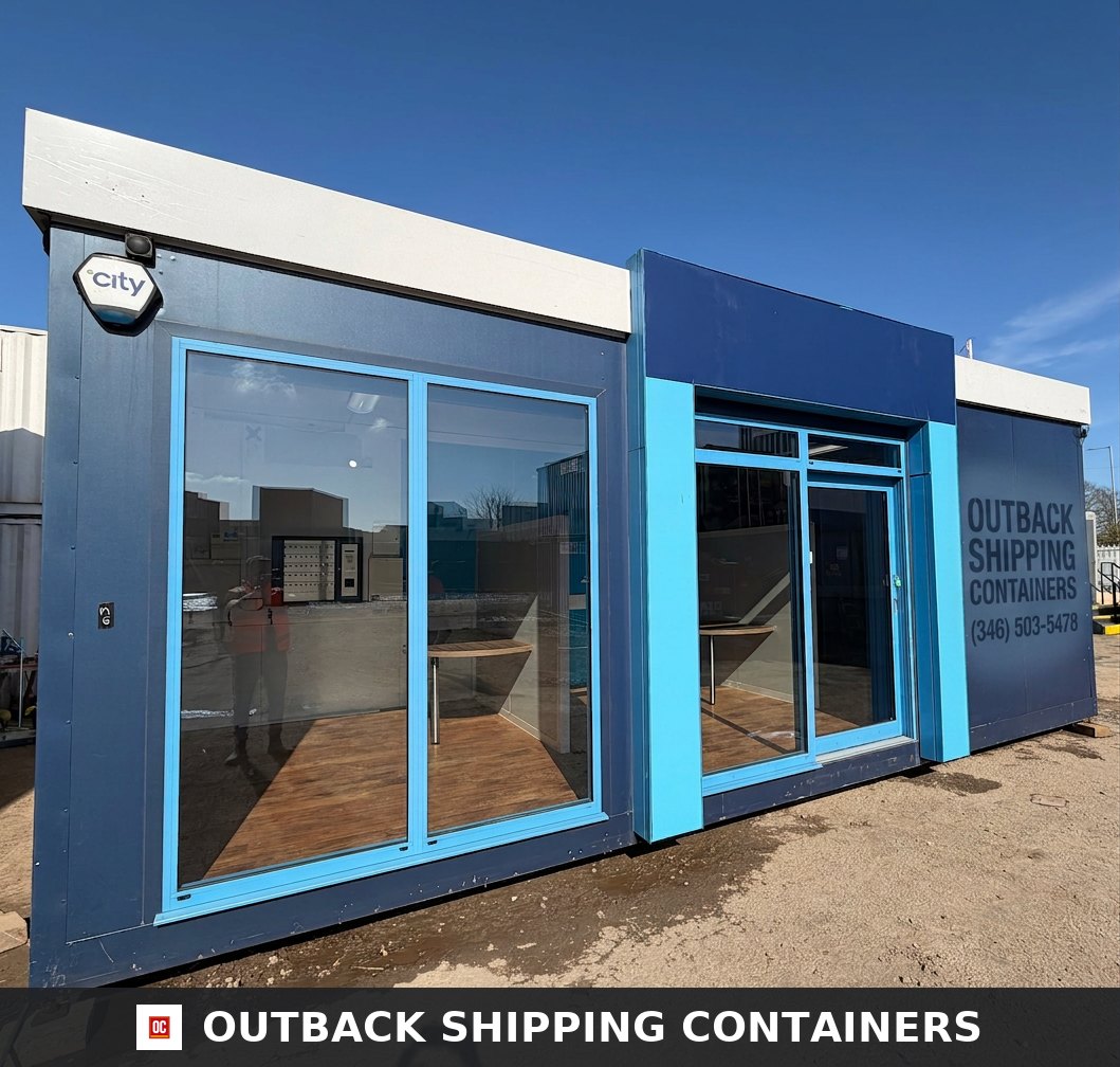 26x12ft for Sale — Side Profile View | Outback Shipping Containers 26x12ft marketing suite sales pod with blue facade large glass windows and wood style flooring under a clear blue sky