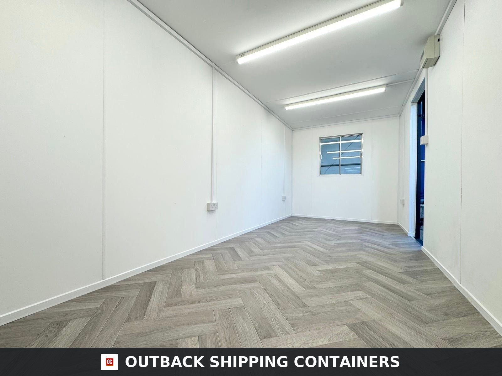 20x8ft for Sale — Window and Shutter Detail | Outback Shipping Containers Interior of a refurbished 20ft shipping container office with grey herringbone flooring and white walls