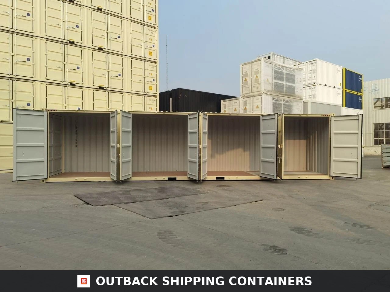 40ft HC Open Side Container with 4 Doors — Door and Entry Detail | Outback Shipping Containers 40ft high cube open side shipping container with all four side doors open in a storage yard with stacked units