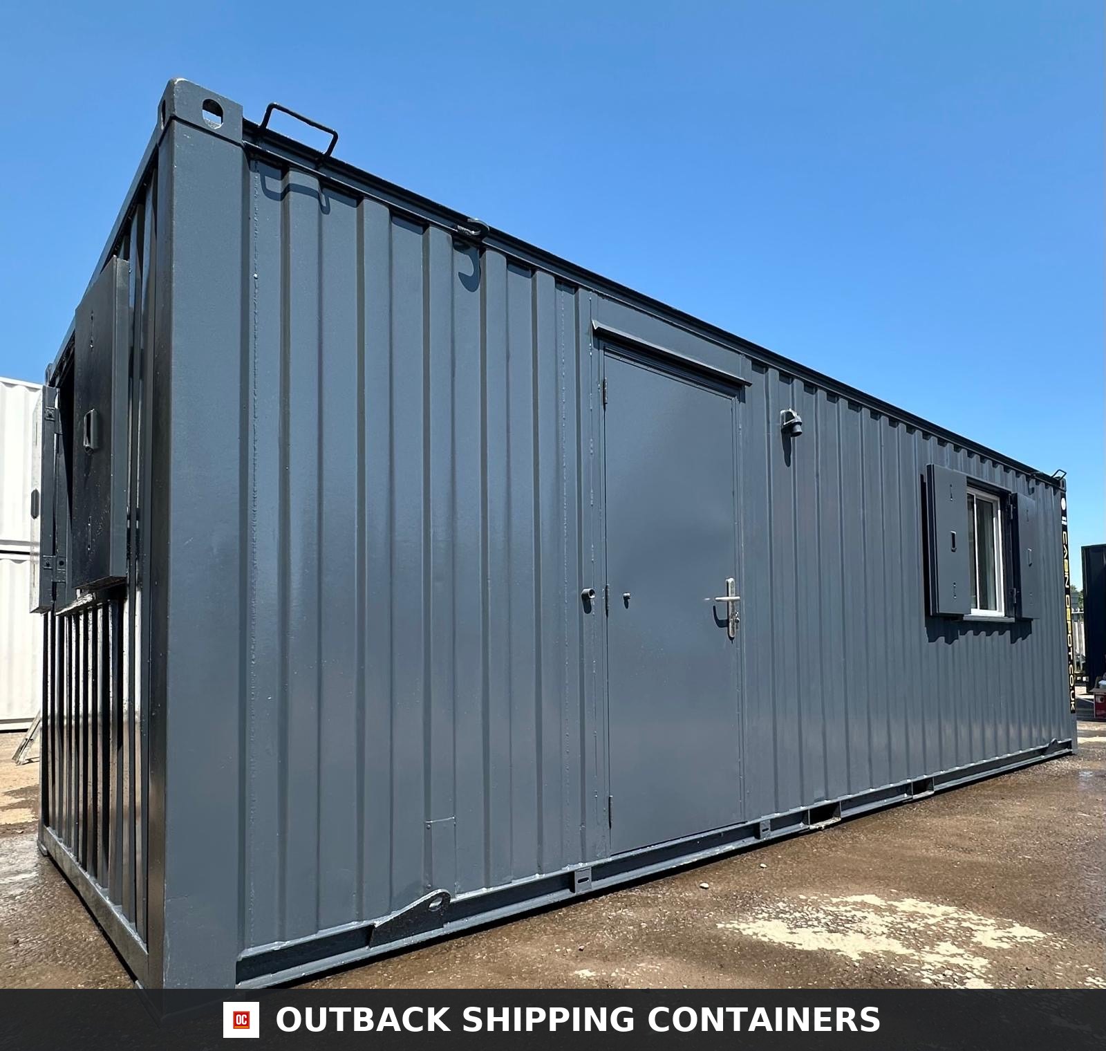 24x9 ft 24x9FT for Sale — Three-Quarter Angle View | Outback Shipping Containers Refurbished 24x9 open plan office container cabin in dark gray with steel security shutters and personnel door