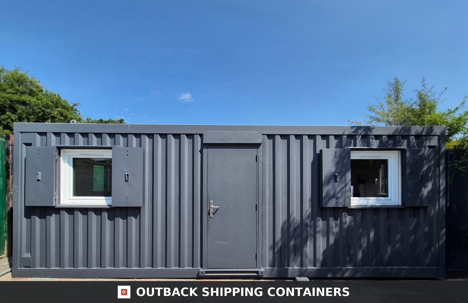 Modular Building 2 Bay 24x20FT for Sale — Rear Exterior View | Outback Shipping Containers Refurbished 24x20ft modular office interior with desks, computers, whiteboards, and gray industrial carpeting