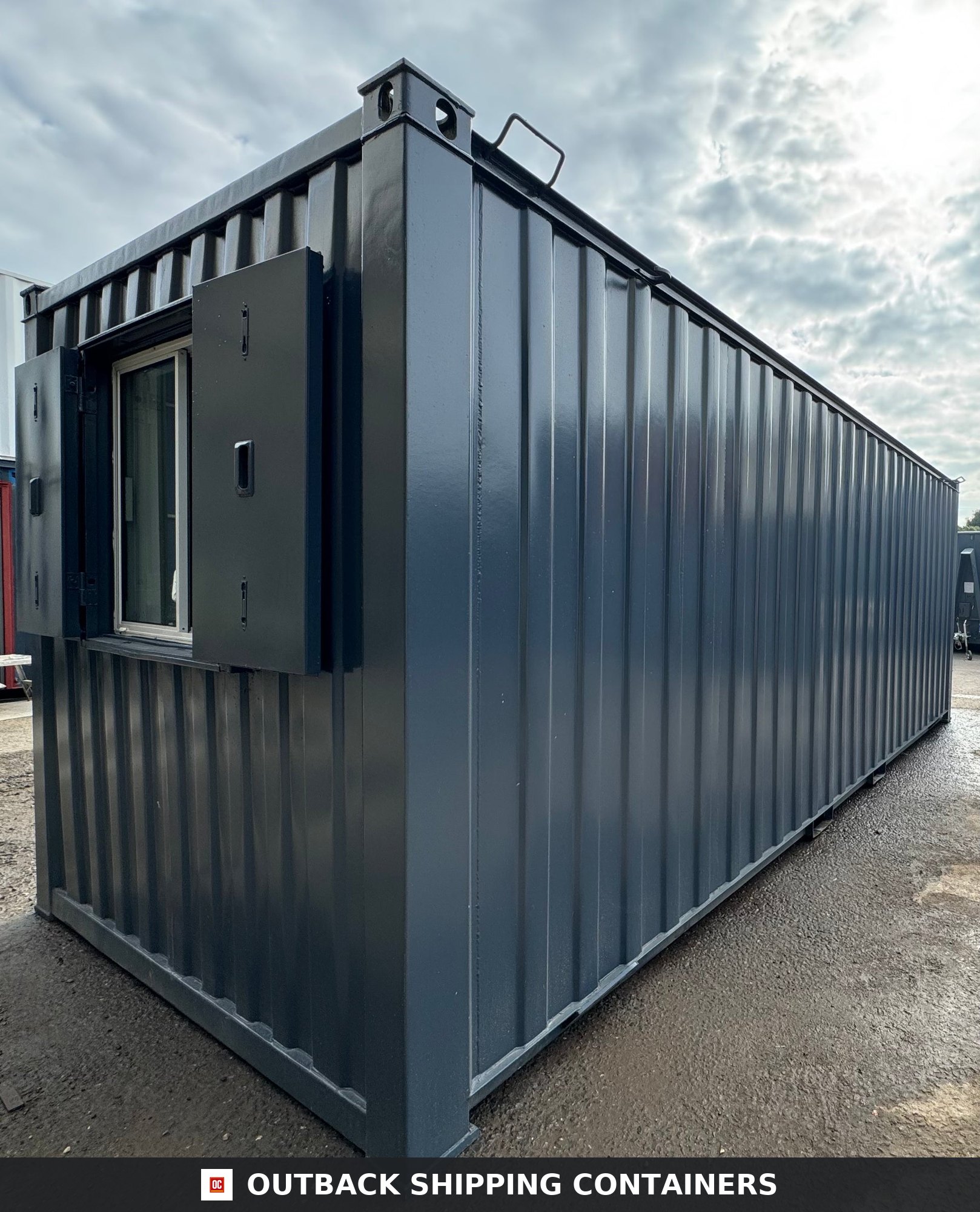 21x8ft for Sale — Interior Detail | Outback Shipping Containers 2 Side profile of a navy blue 21ft portable anti-vandal office container with steel security shutters over a single window