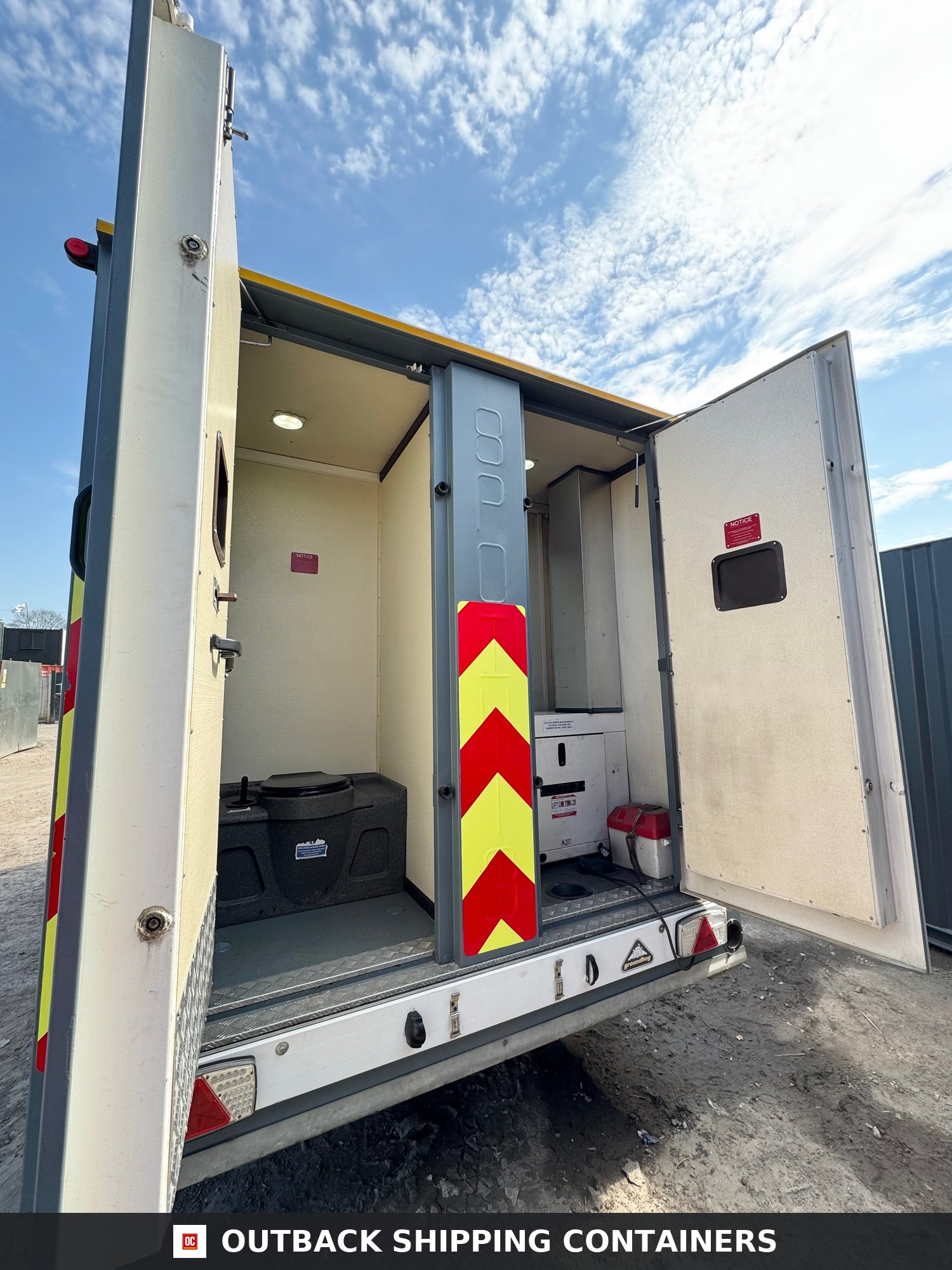Groundhog Towable Mobile Welfare | 2019 Twin Axle 16ft Welfare | GPO500 — Interior View Rear interior view of a Groundhog GPO500 mobile welfare unit showing a portable toilet and equipment bay
