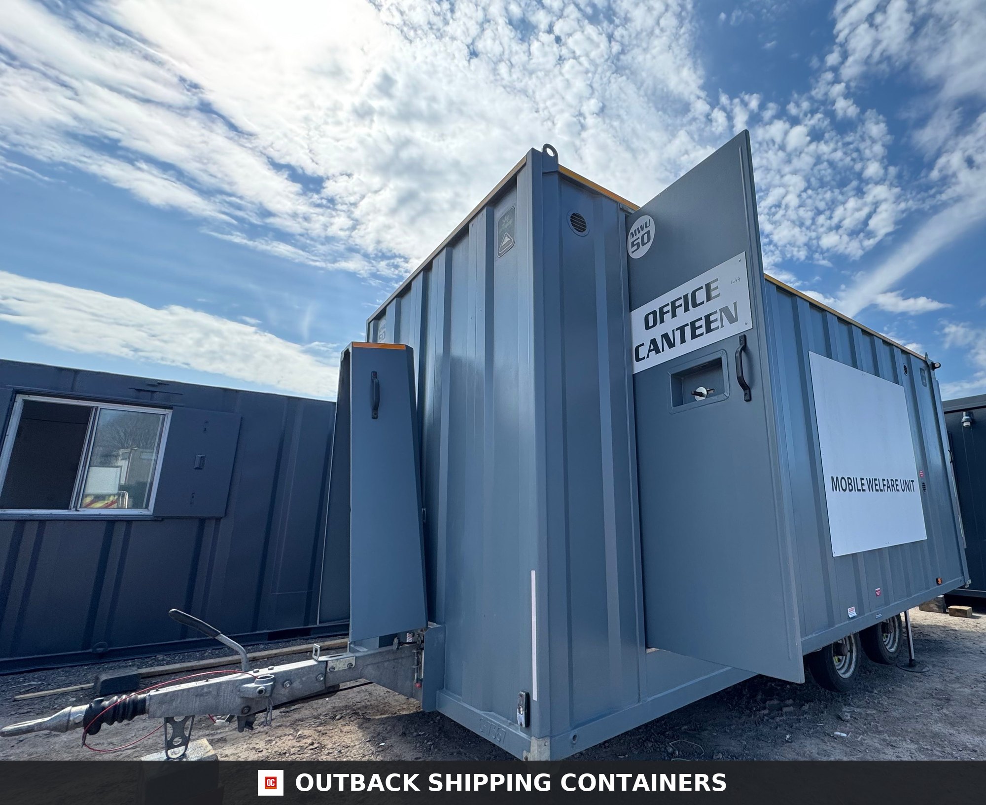 Groundhog Towable Mobile Welfare | 2019 Twin Axle 16ft Welfare — Door and Entry Detail Refurbished Groundhog towable mobile welfare unit with office canteen door open and twin axle chassis