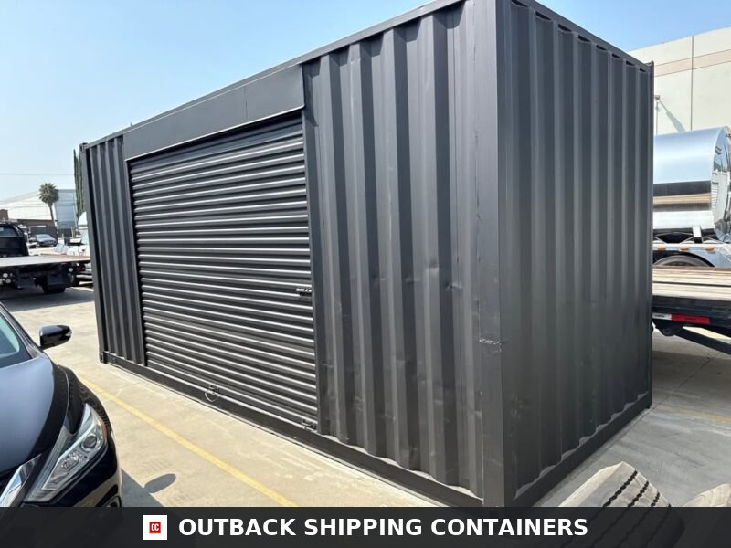 20ft matte black shipping container with 12 foot side roll-up door installed outdoors on a concrete lot