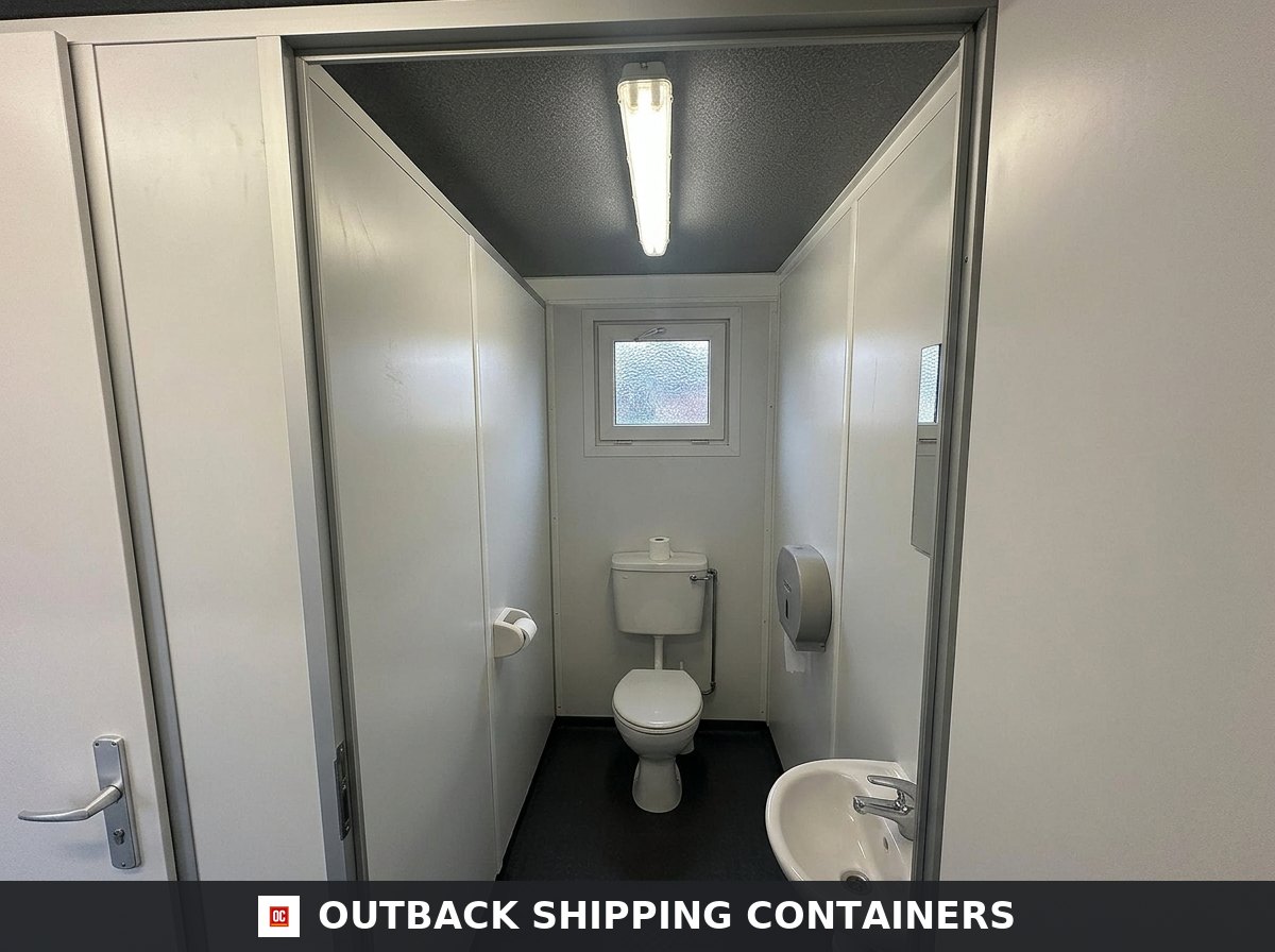 16 x 8 ft for Sale — Rear Exterior View | Outback Shipping Containers Interior of the 16 x 8 ft toilet block cubicle with WC pan, cistern, hand basin and vinyl floor