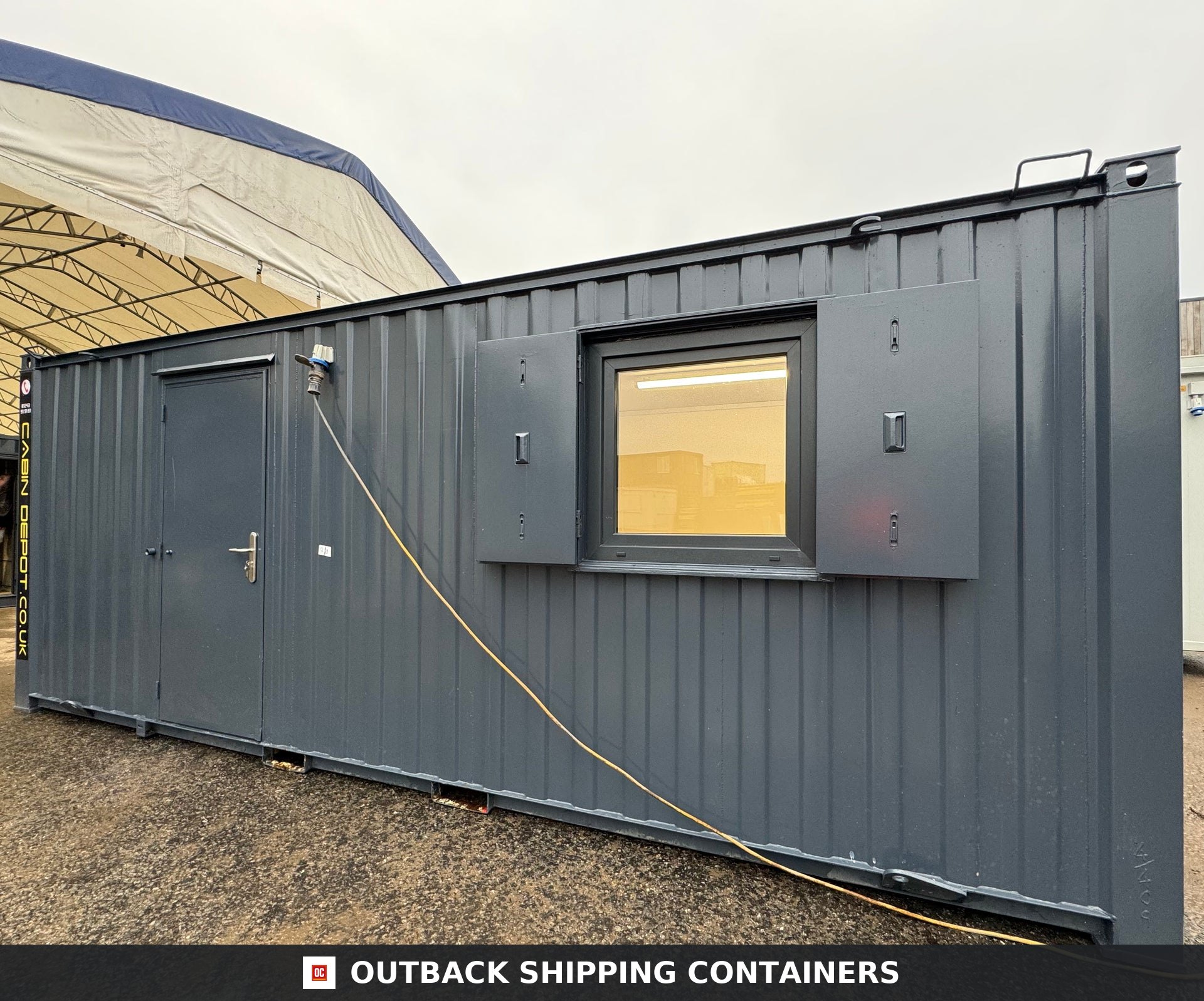 21x8ft Office Container for Sale — Interior View | Outback Shipping Containers 21x8ft grey portable office container with open security shutters on windows and side door entry