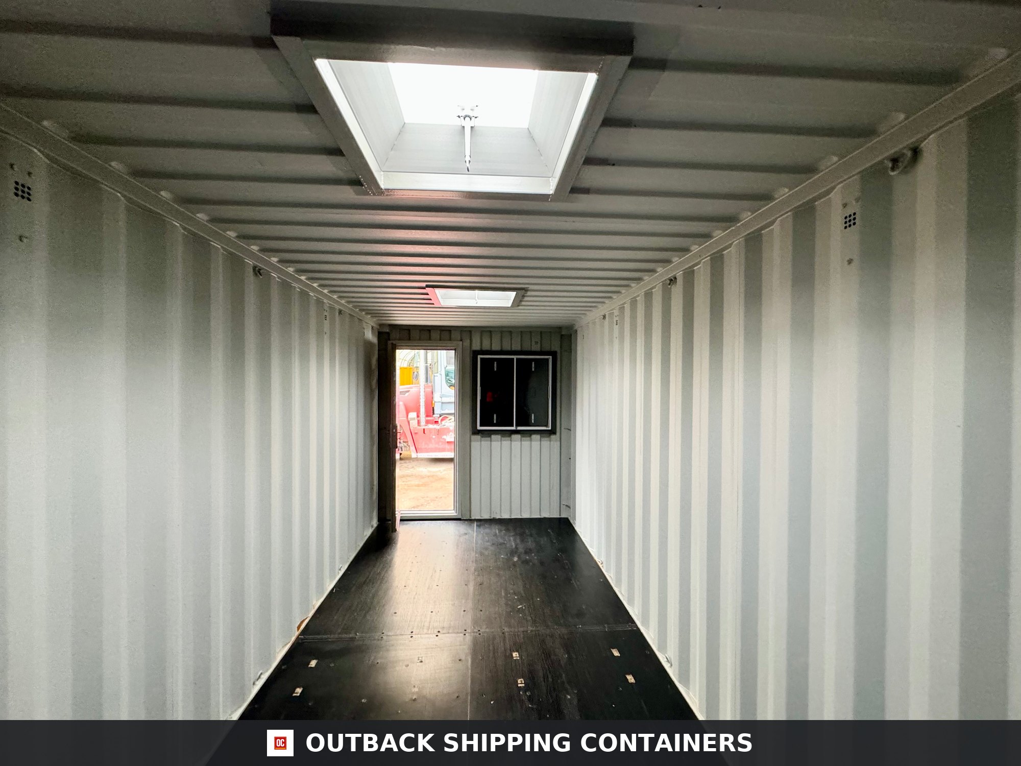 20x8ft CUSTOM Converted/Modified Shipping Container — Jet Black for Sale — Rear Exterior View Jet Black 20x8ft custom container — angle 4