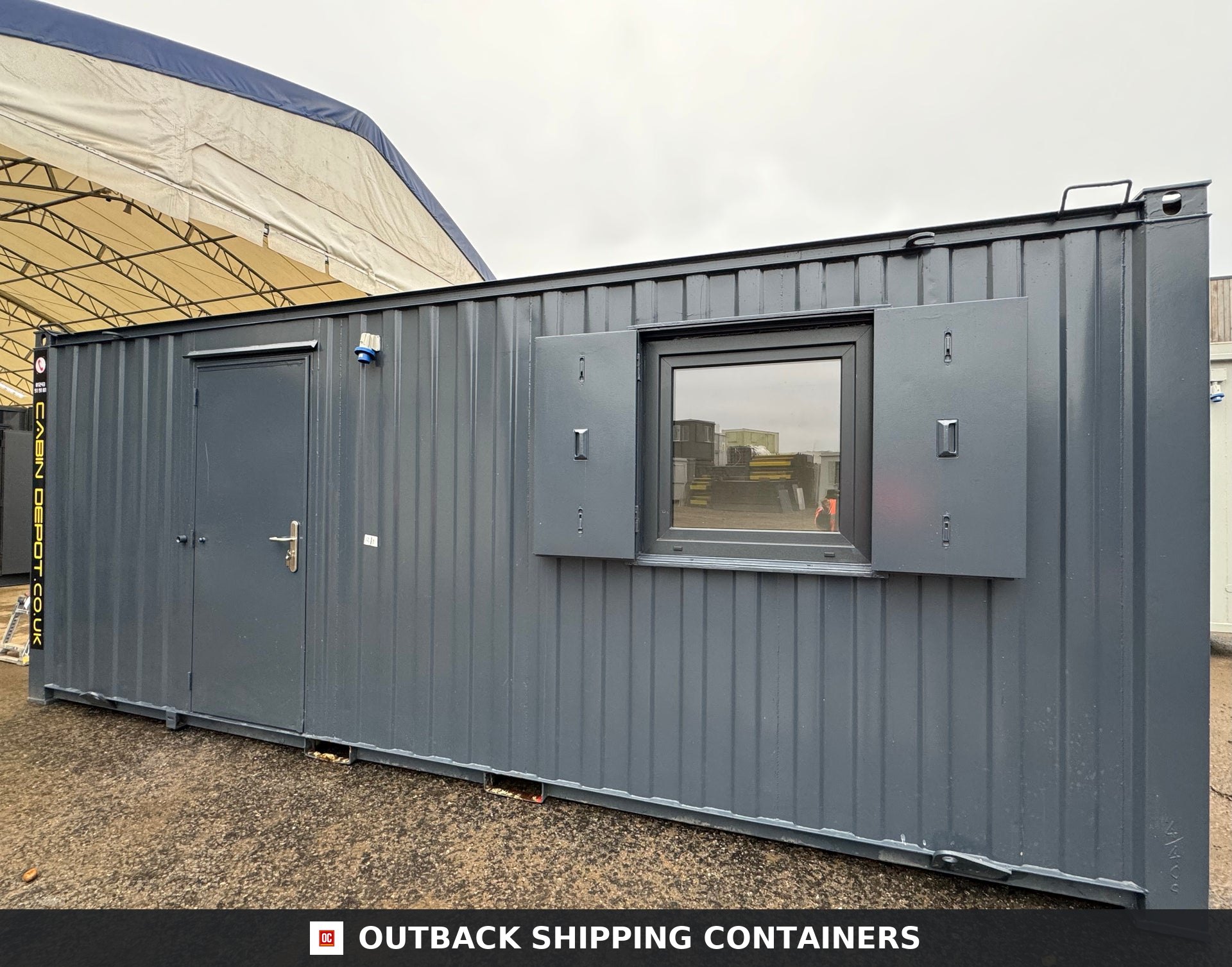 21x8ft Office Container for Sale — Three-Quarter Angle View | Outback Shipping Containers Interior of a refurbished 21ft office container with white walls, herringbone wood flooring, and two windows