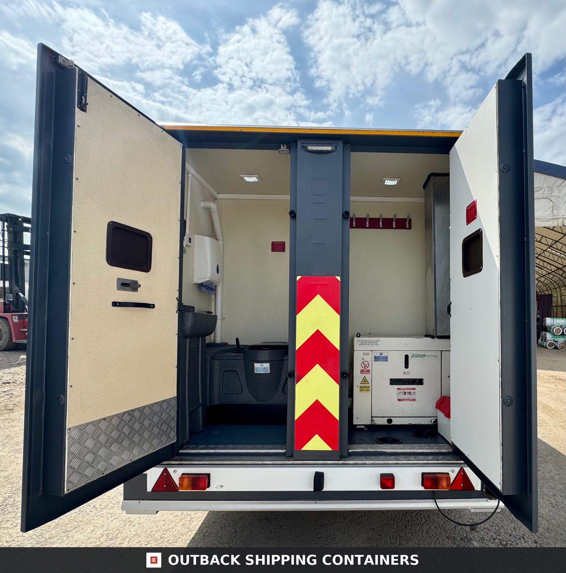 Groundhog Towable Mobile Welfare | 16 Ft | 2017 |Twin Axle | GPO500 | Building — Interior View Rear view of open Groundhog towable welfare unit showing toilet area and internal generator compartment