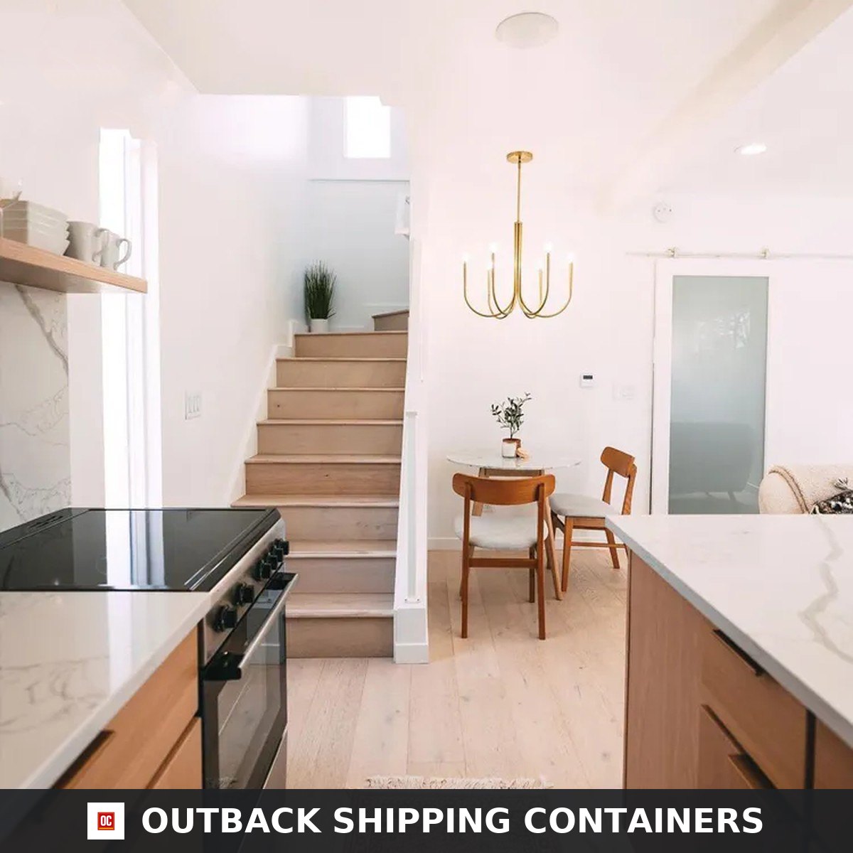 Internal timber staircase and dining area inside the Duplex 3BHK prefab container home with brass chandelier
