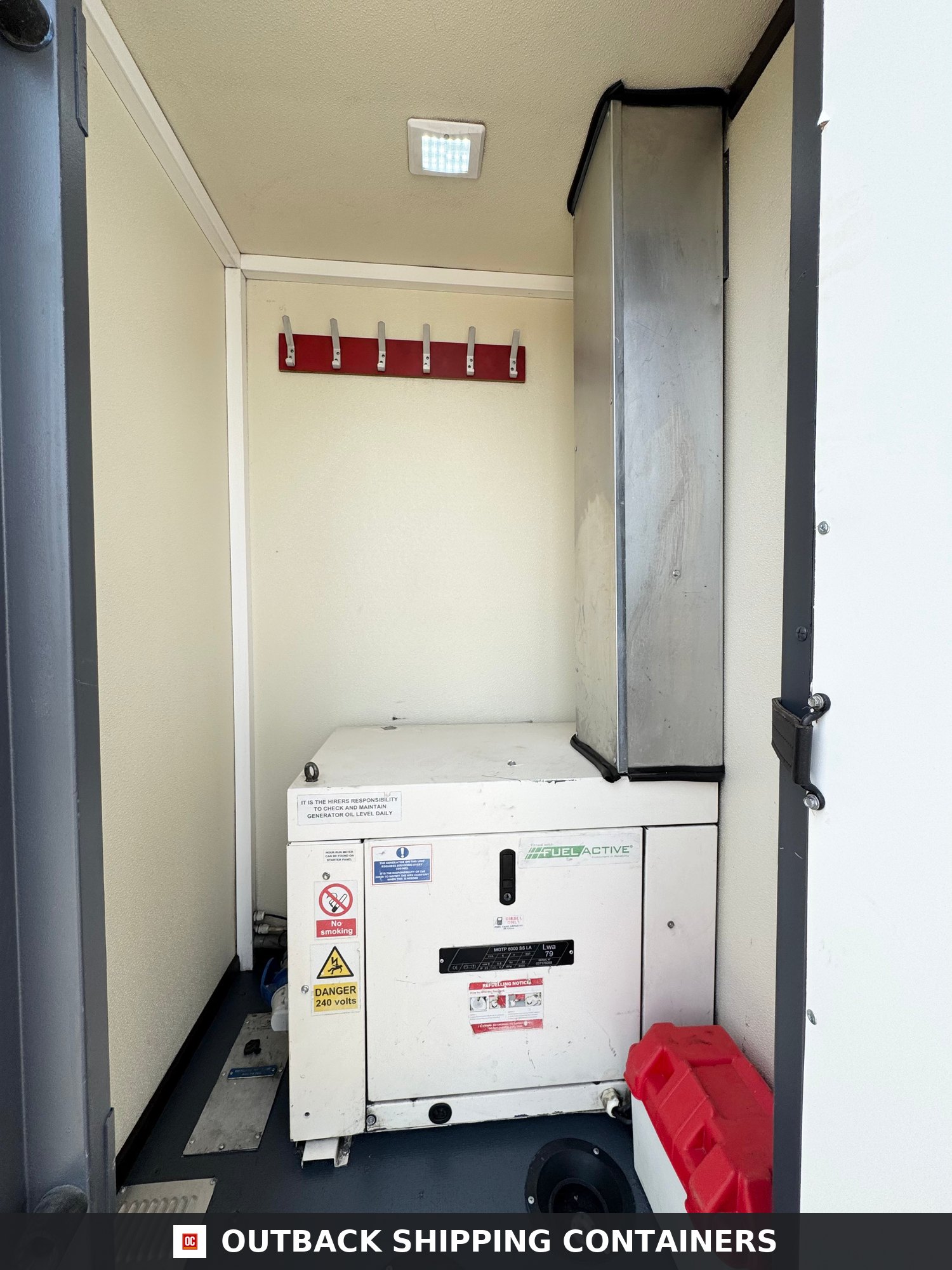 Groundhog Towable Mobile Welfare | 16 Ft | 2017 |Twin Axle — Roof and Structural Detail Internal generator compartment of a Groundhog GPO500 mobile welfare unit with safety labels and coat hooks