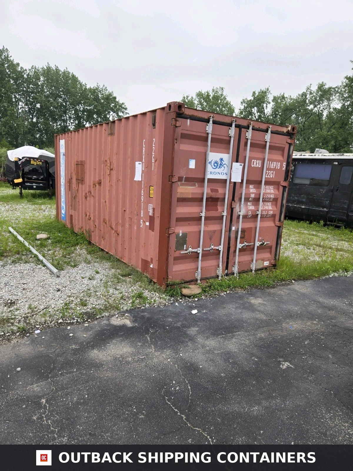 Durable & Affordable Used 20′ Storage Containers / Storage Pods — Three-Quarter Angle View Used 20ft storage container in rust red color with closed double doors and locking bars on a gravel lot