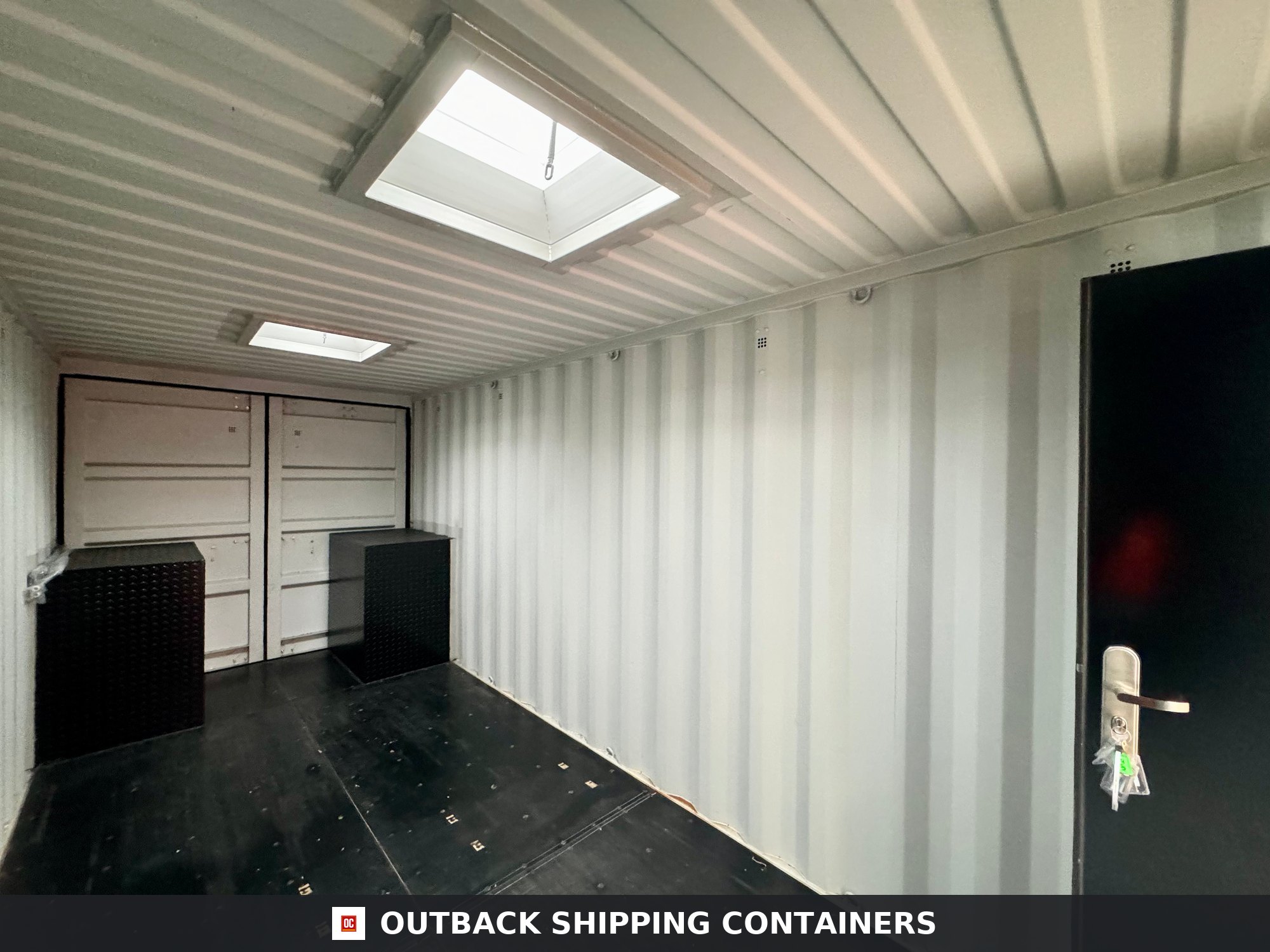 20x8ft CUSTOM Converted/Modified Shipping Container — Jet Black for Sale — Side Profile View Jet Black 20x8ft custom container — angle 2