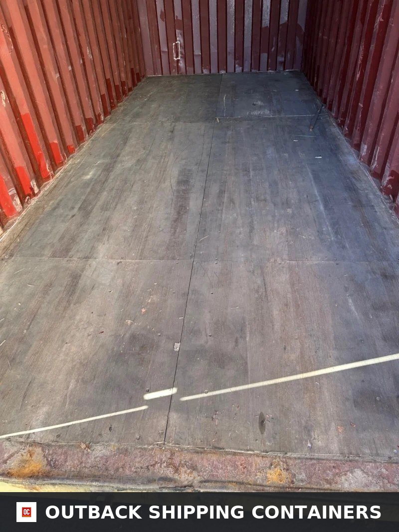 Used 20ft Conex Shipping / Storage Container — Interior View | Outback Shipping Containers 20ft used shipping container interior showing marine-grade plywood flooring and corrugated red steel walls
