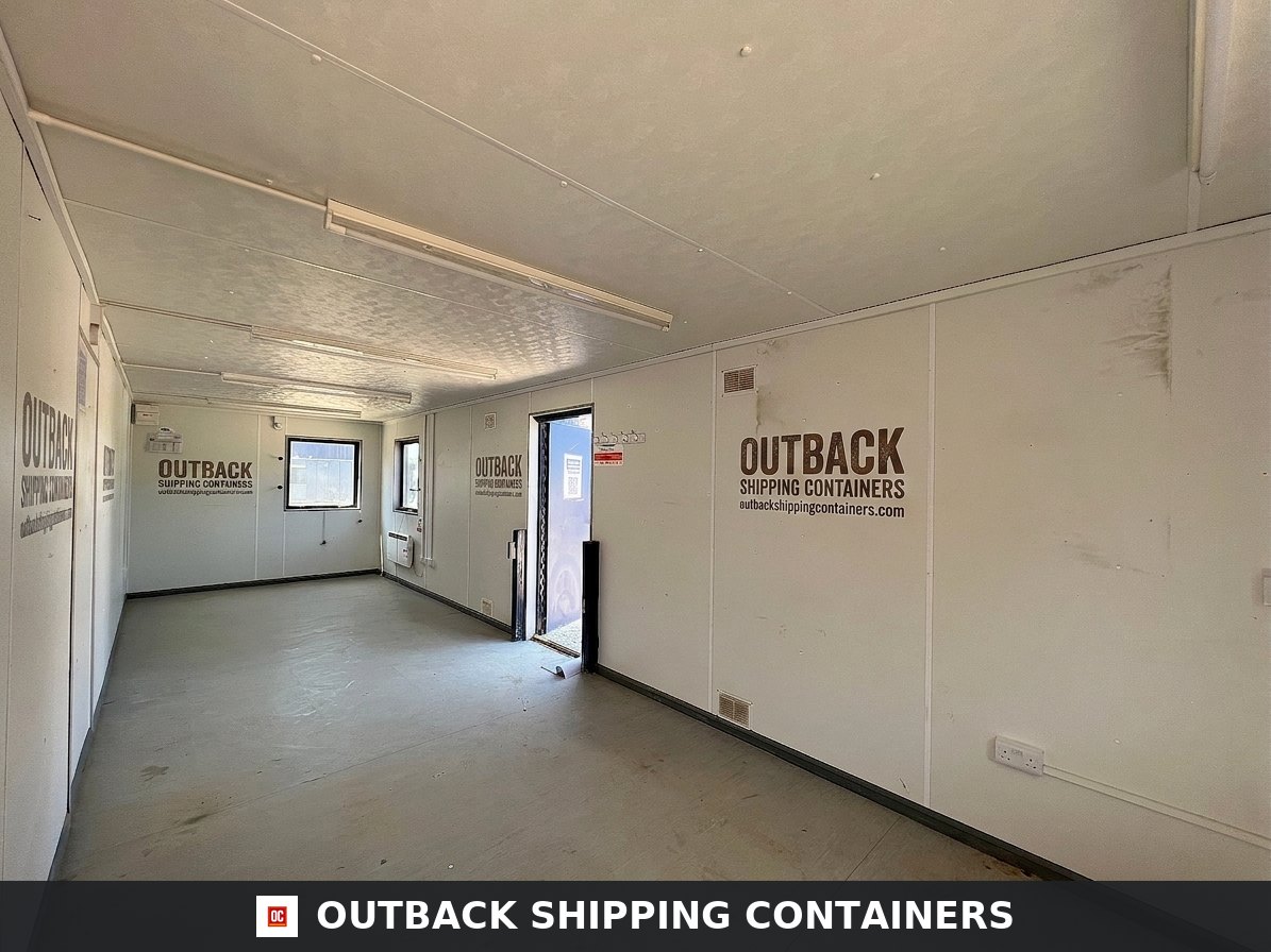 24x9 ft 24X9FT for Sale — Three-Quarter Angle View | Outback Shipping Containers Interior view of a 24x9 ft open plan portable office cabin with white walls and overhead LED lighting