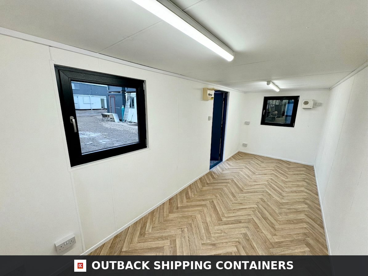 21x8ft Office Container for Sale — Side Profile View | Outback Shipping Containers 21x8ft refurbished office container interior with herringbone vinyl flooring and white walls