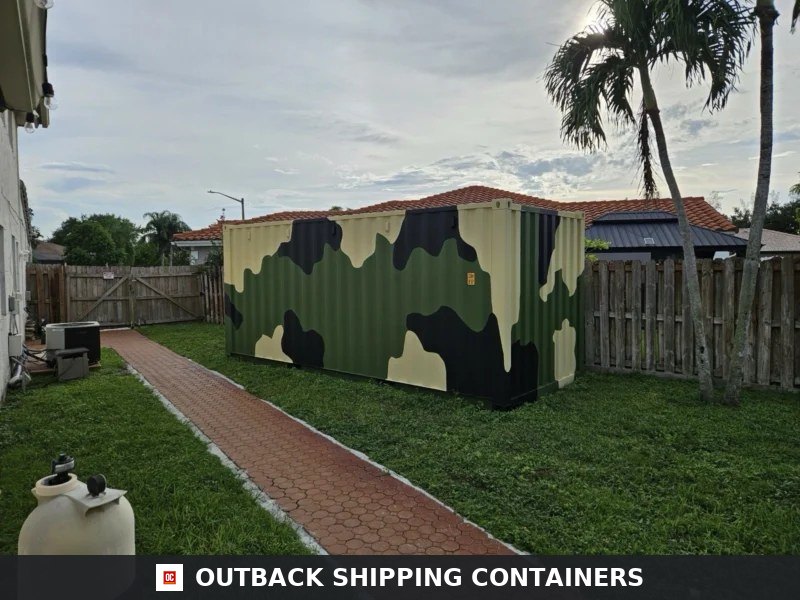 20ft camouflage shipping container in a residential backyard with green grass and palm trees nearby