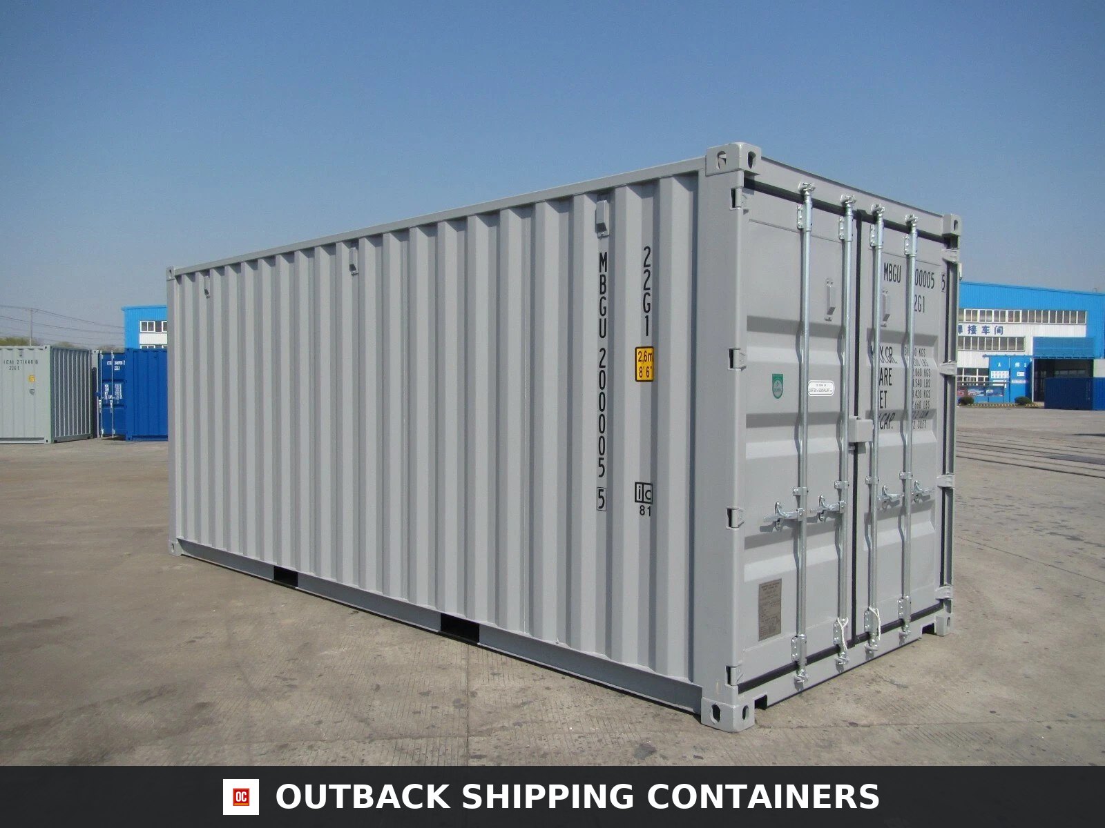 20ft grey shipping container in new condition with double doors and locking bars on a concrete yard