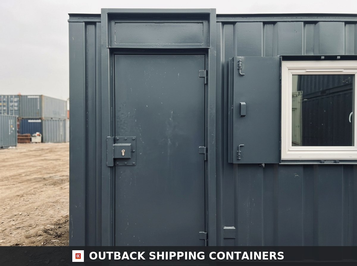 24x8 ft 24X8FT for Sale — Rear Exterior View | Outback Shipping Containers Close-up of the 24x8 ft cabin steel personnel door with lock guard beside the shuttered window