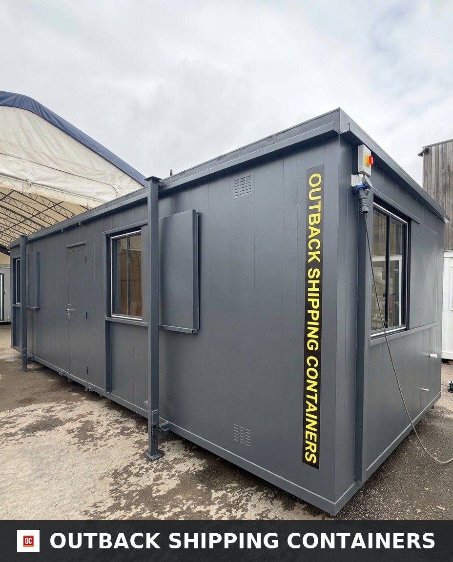 32x10Ft for Sale — Rear Exterior View | Outback Shipping Containers Interior of a refurbished 32x10 canteen office cabin with white walls and gray herringbone flooring