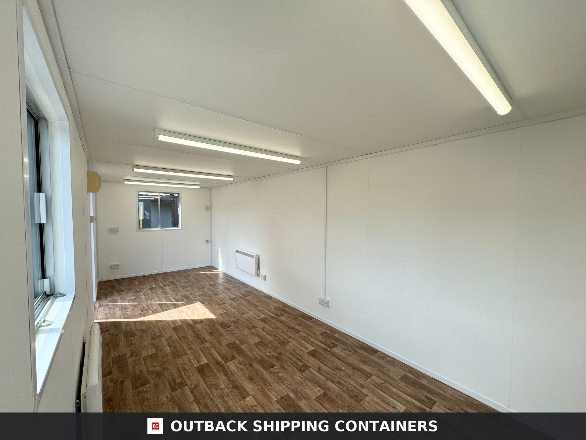 24x9 ft 24x9FT for Sale — Roof and Structural Detail | Outback Shipping Containers 24x9 ft open plan portable office interior with wood vinyl floors, white walls, LED lighting, and windows